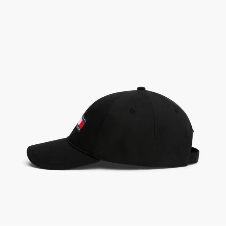 Black cap with a small flag patch on a white background
