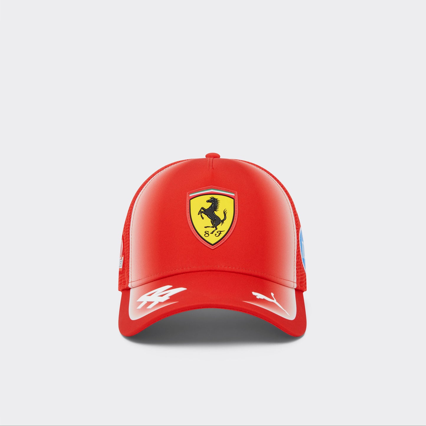 Red cap with Ferrari logo on a light gray background